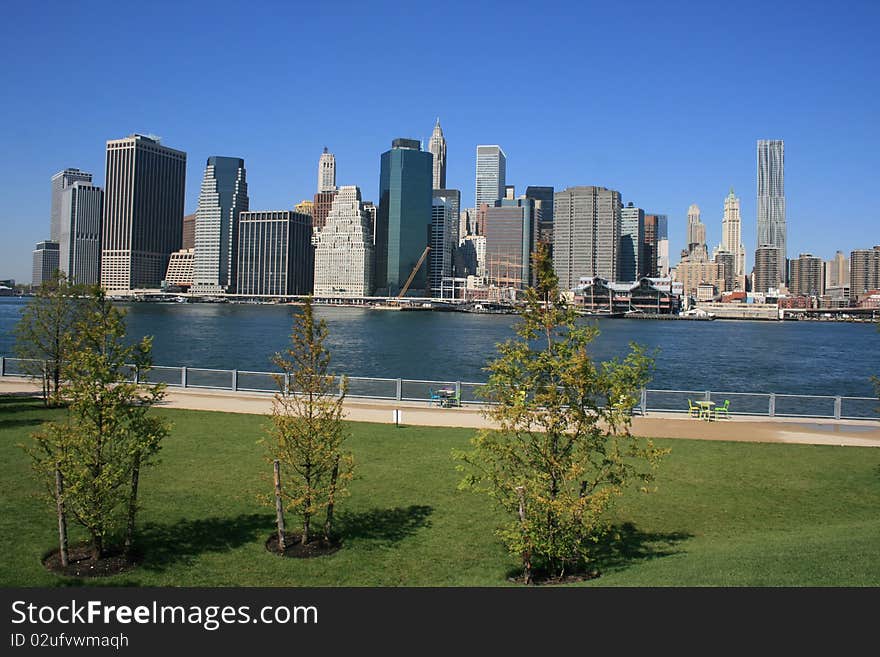 Lower Manhattan skyline and East River as seen from Brooklyn Bridge Park. Lower Manhattan skyline and East River as seen from Brooklyn Bridge Park.