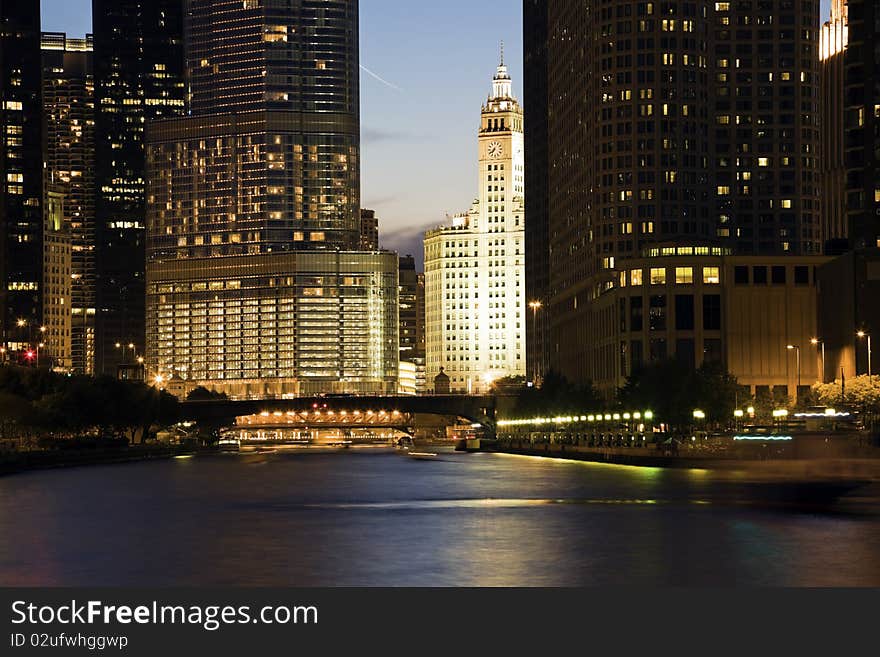 Wrigley Building surrounded by skyscrapers - Chicago, IL.