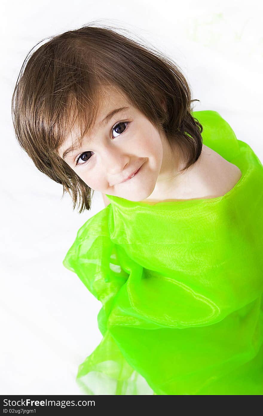 Portrait of a little girl in studio in green isolated. Portrait of a little girl in studio in green isolated