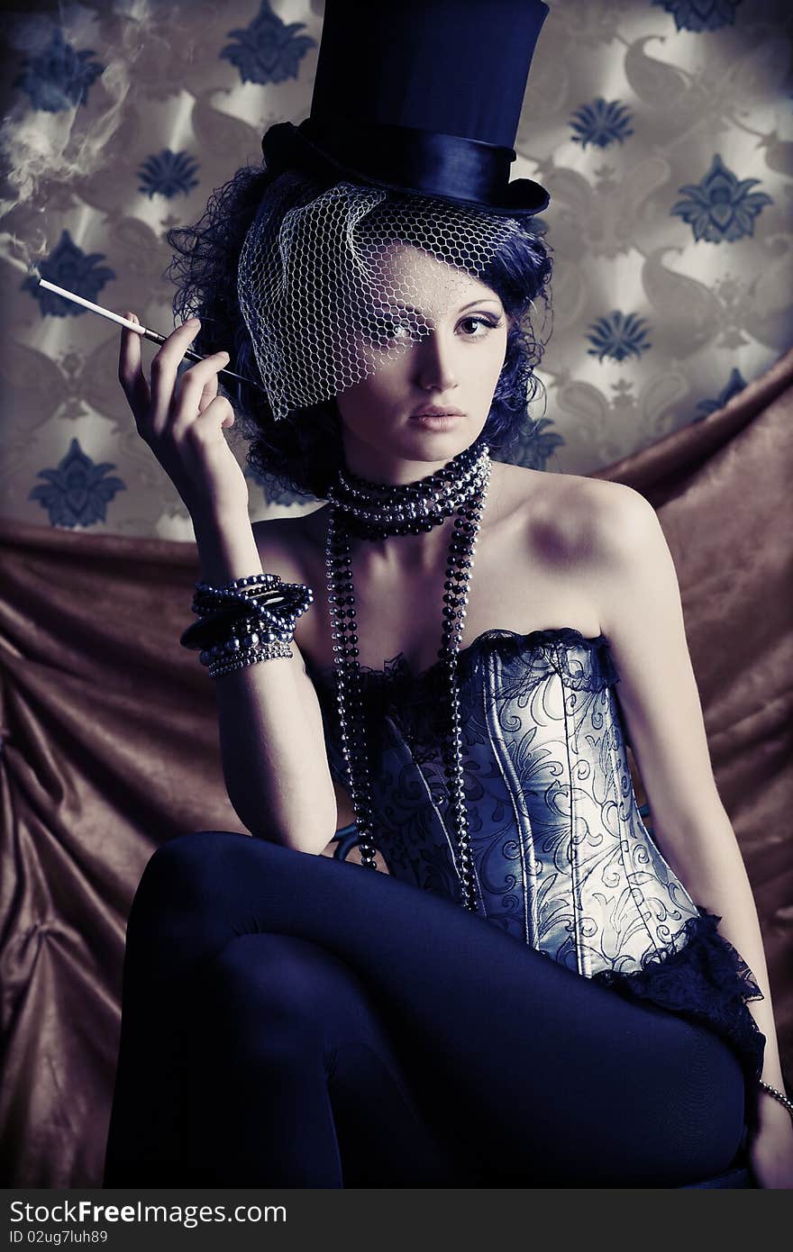 Beautiful fashionable woman over vintage background. Beautiful fashionable woman over vintage background.