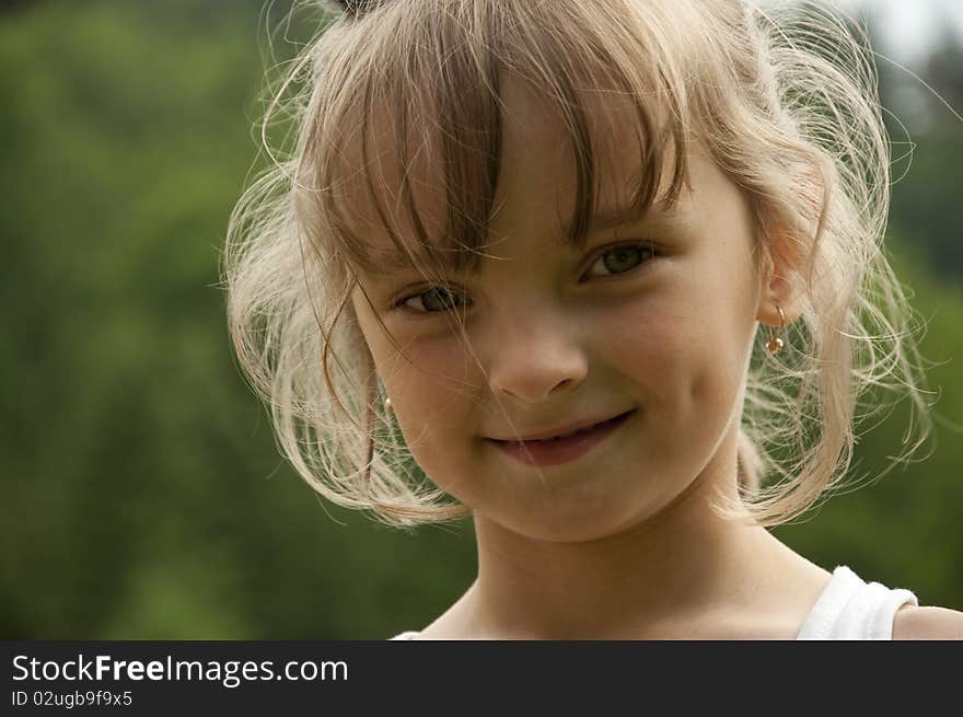 Little girl on a background the forest