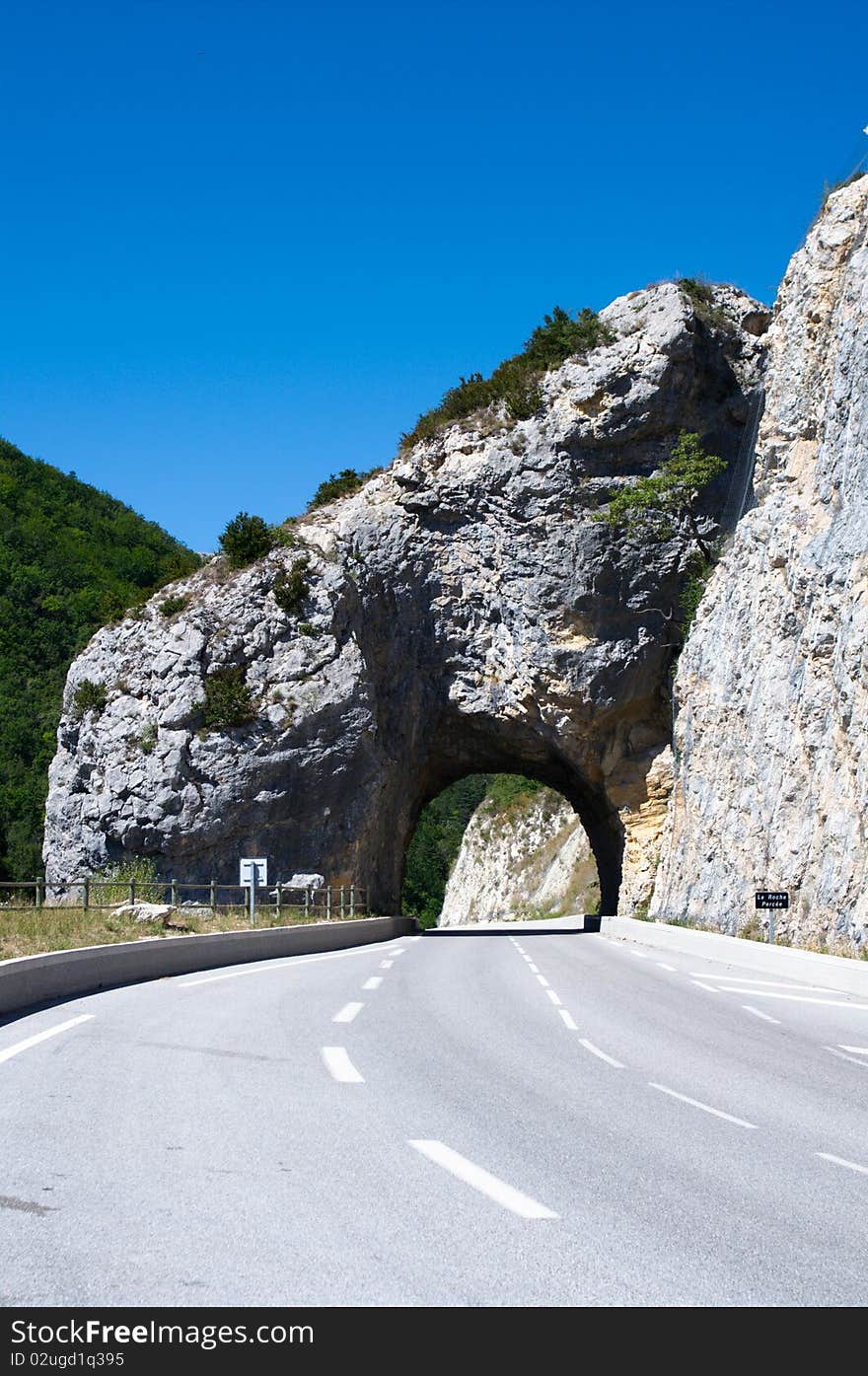 Arc tunnel in mountain road