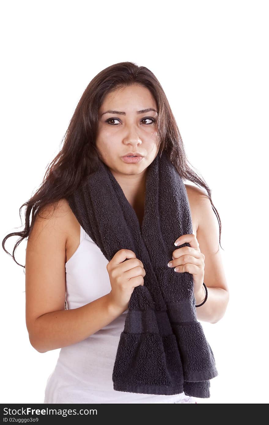 A woman is looking exhausted and holding a black towel around her neck. A woman is looking exhausted and holding a black towel around her neck.