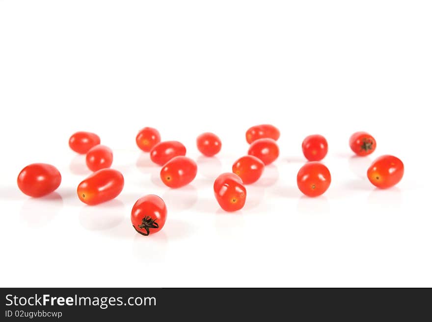 Cherry tomatoes on the white isolated background