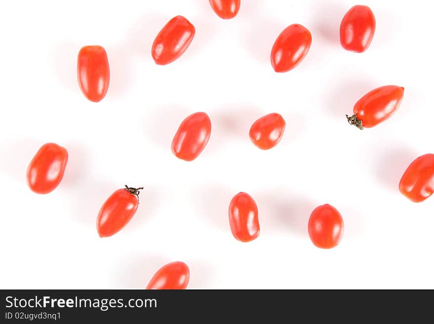 Cherry tomatoes on the white isolated background