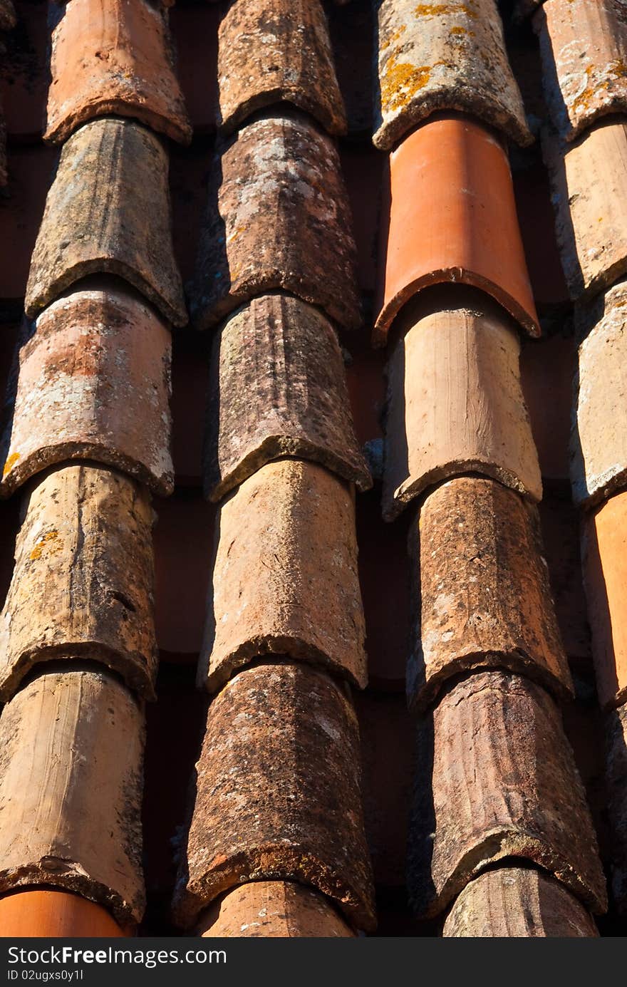 The red tiled roof of an ancient building in Croatia. The red tiled roof of an ancient building in Croatia