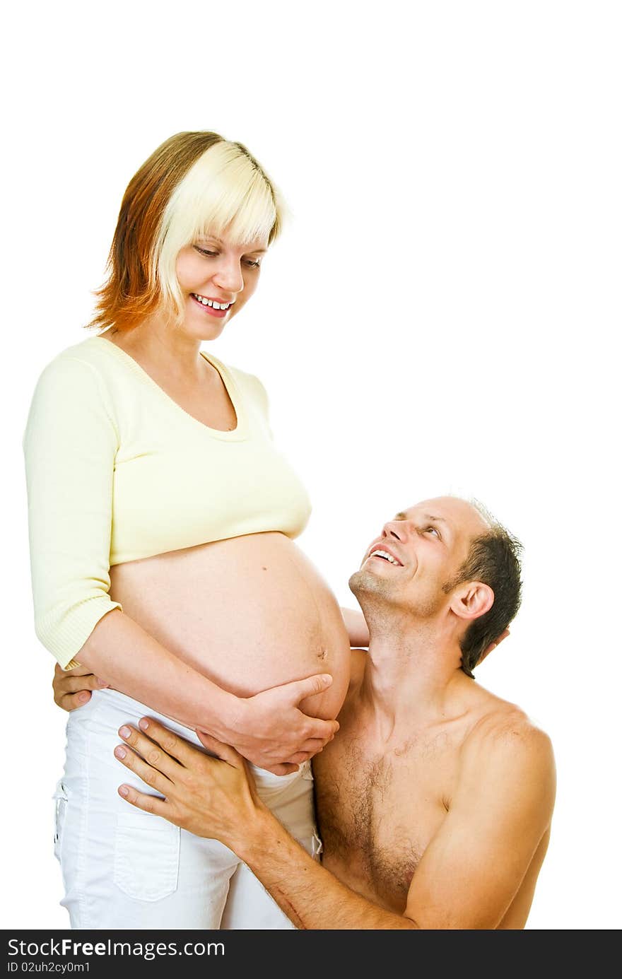 Young pregnant woman with her man on white background. Young pregnant woman with her man on white background