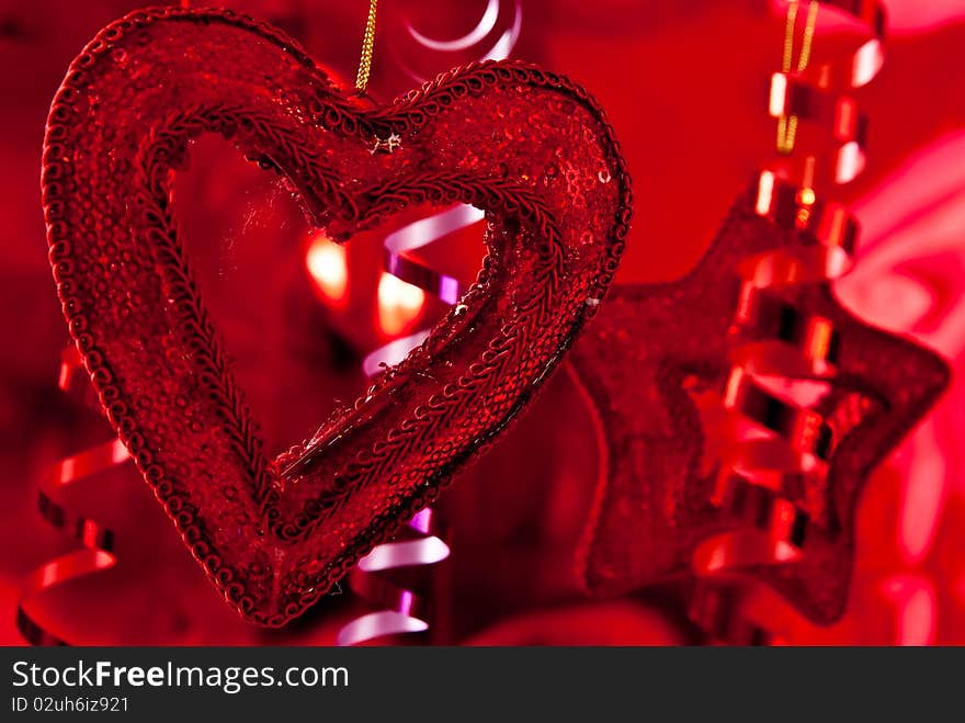 Red christmas baubles and ribbons on red background. Red christmas baubles and ribbons on red background