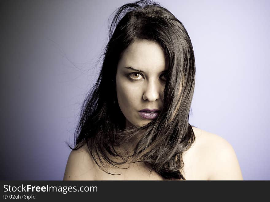 Voluptuous look of brunette young woman. intense expression