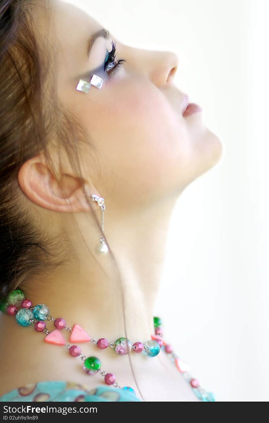 Portrait of a girl in profile, isolation on a white background