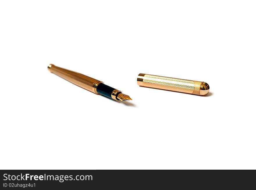 Gold fountain pen on white background with the cap off. Gold fountain pen on white background with the cap off