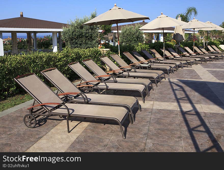 Chaise longue and umbrellas.