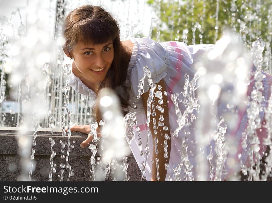 Portrait of a girl in the fountain