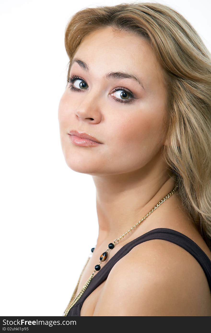 Close up Fashion portrait of a woman in a casual dress holding her hair isolated on white