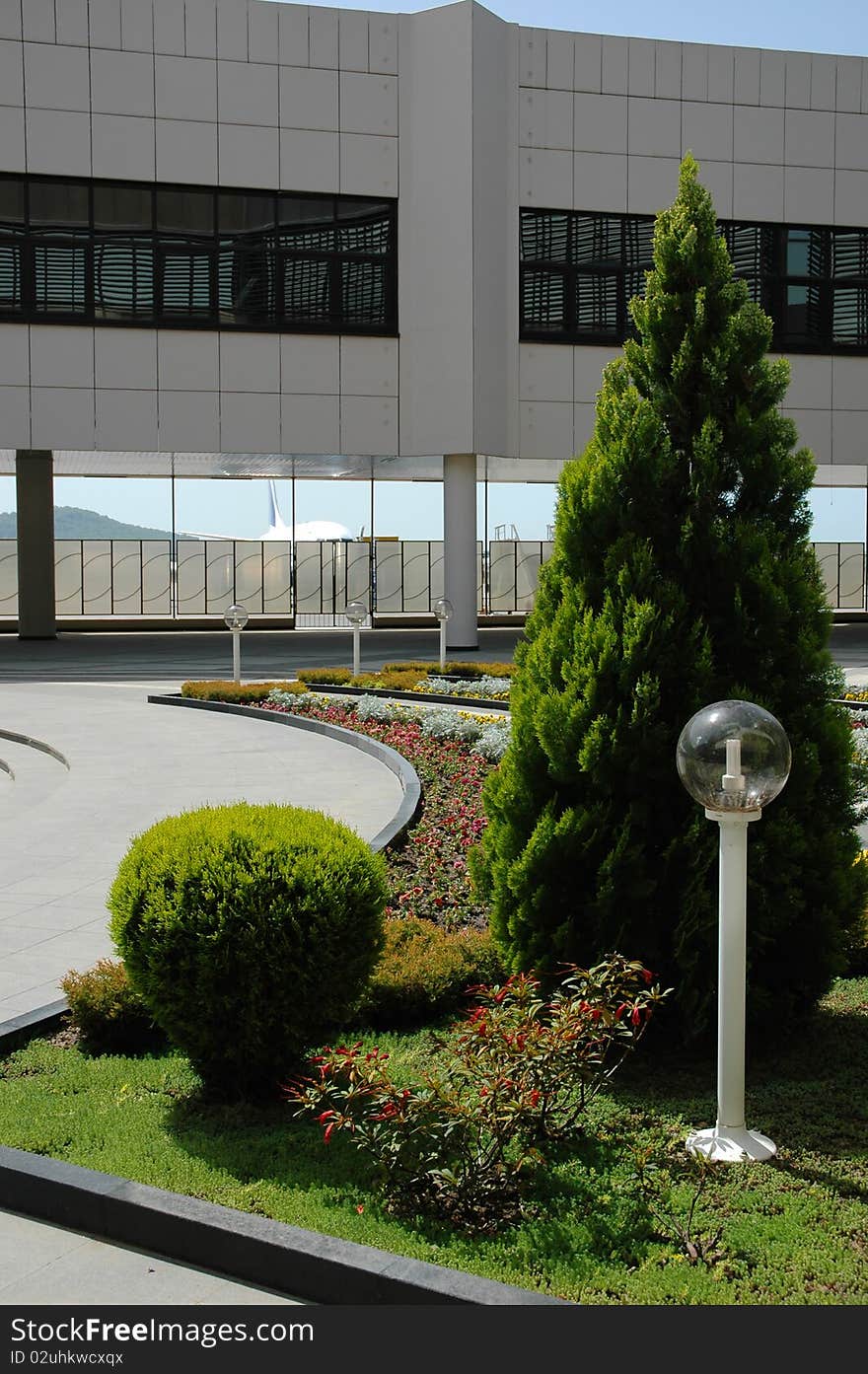 Flowerbed near buildings in aeroport