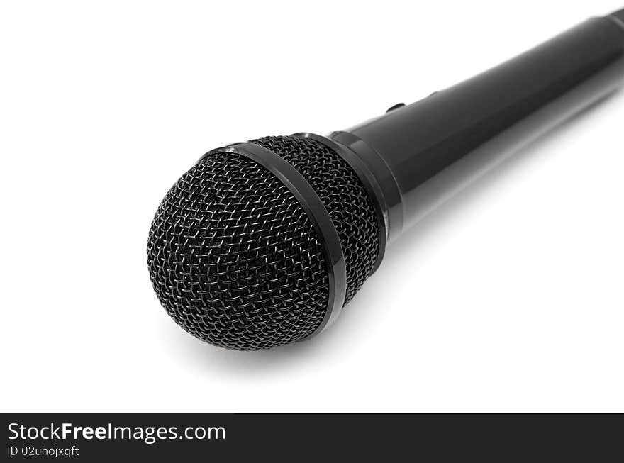 Black microphone isolated on a white background.