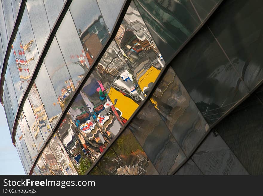 Multicolored reflection n the glass wall of a spherical building. Multicolored reflection n the glass wall of a spherical building.