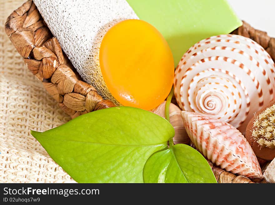 Palm basket with spa accessories isolated on white background. Palm basket with spa accessories isolated on white background.