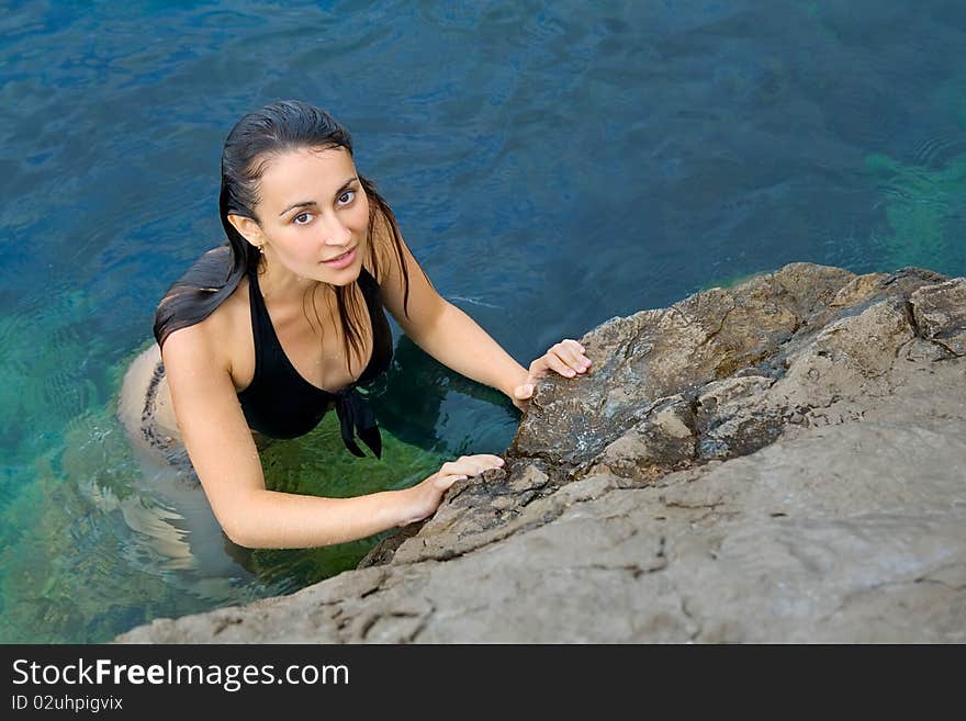 Pretty girl comming out of the sea