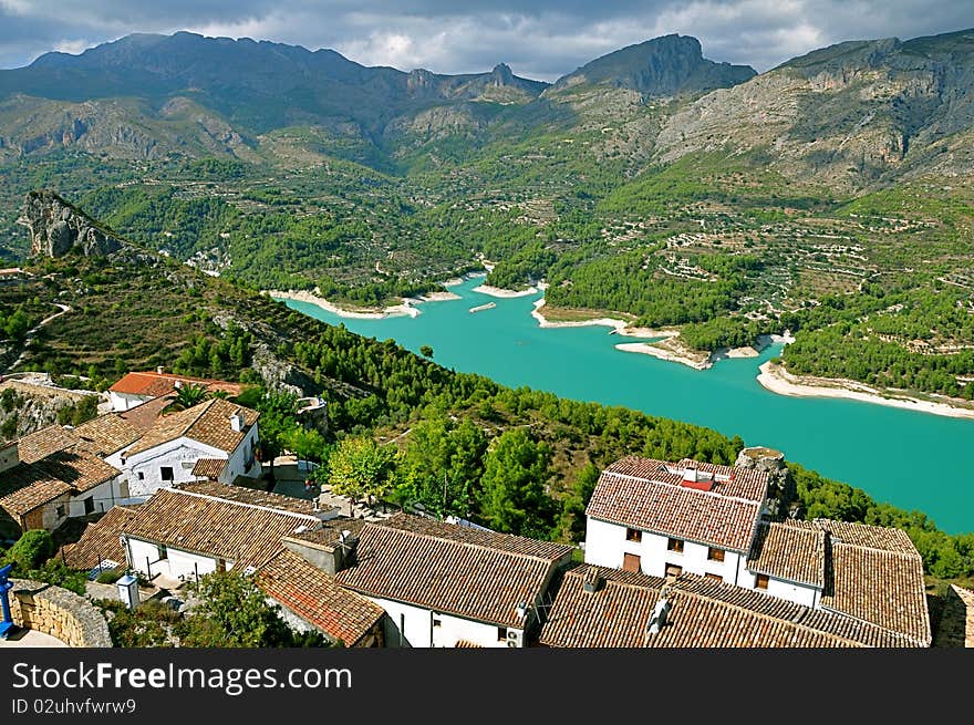 Spain Guadalest mountain sun sky ridge protrusion landscape painting Village blue lake