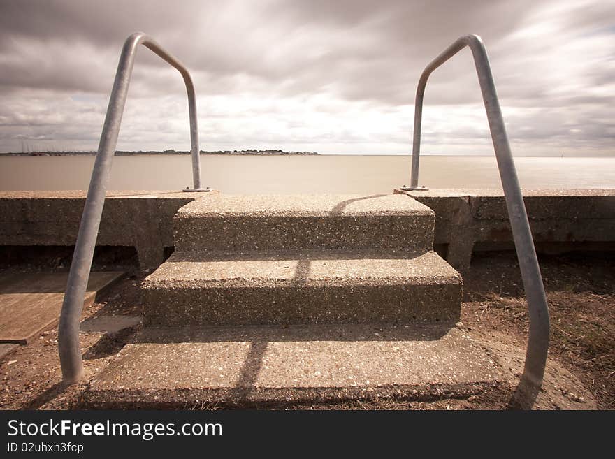 Steps into muddy ocean