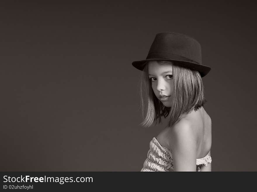 Portrait of happy caucasian girl posing with black hat. Portrait of happy caucasian girl posing with black hat