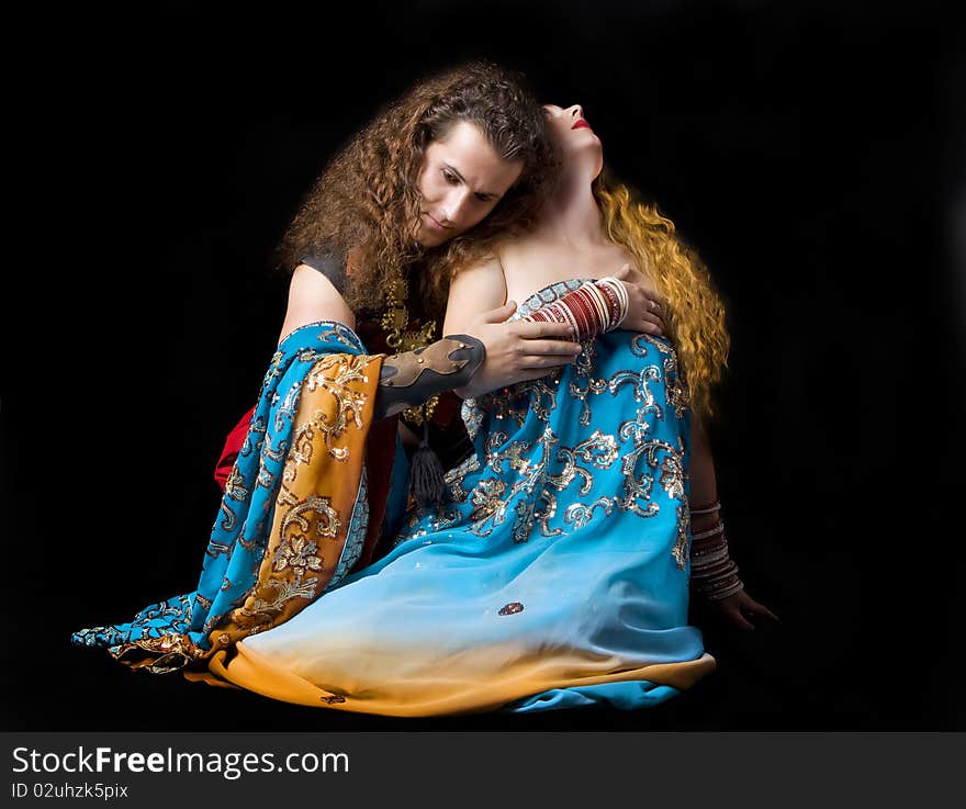 Young couple sit in indian dress. Young couple sit in indian dress