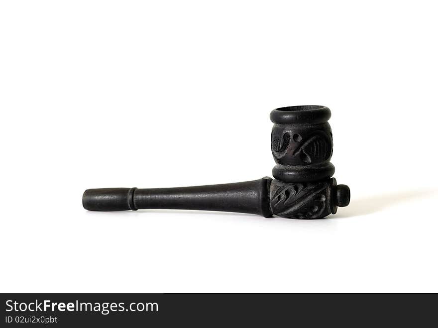 A black smoking pipe with thai wood handicraft isolated on a white background. A black smoking pipe with thai wood handicraft isolated on a white background