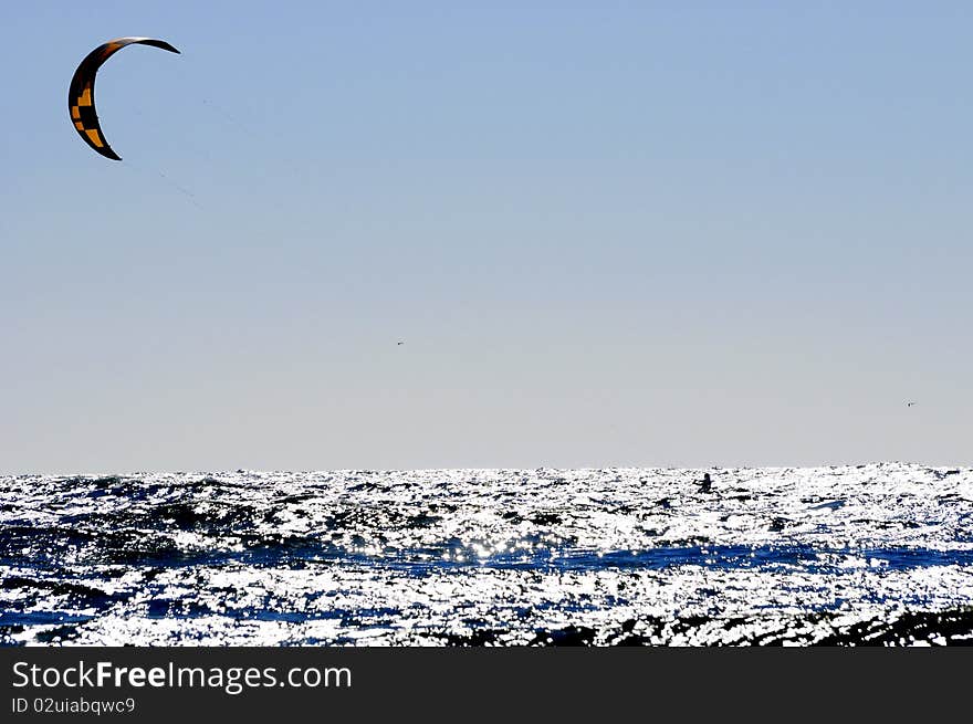 Kite surfing on a blue sea