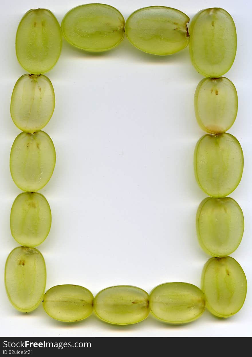 Frame of the sliced green grape on the white background. Frame of the sliced green grape on the white background