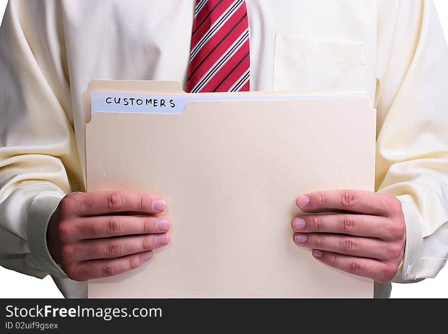 Man in a shirt and a tie holding a manila customer folder. Man in a shirt and a tie holding a manila customer folder.