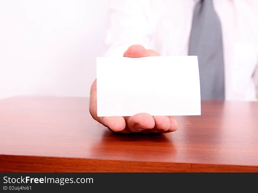 Executive hand delivering a blank business card