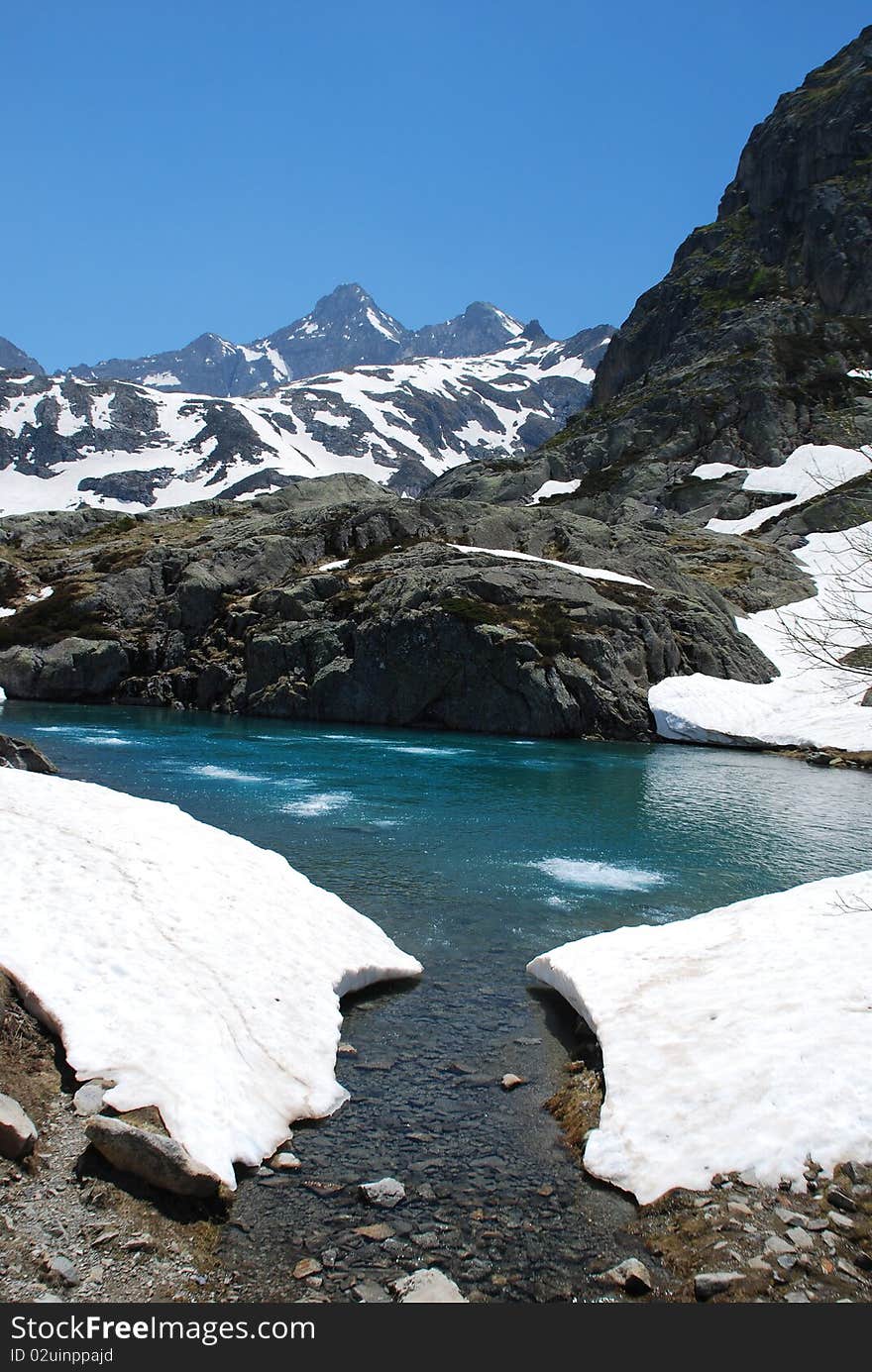 Lake Artouste situatad at 1997 m, in the border of Atlantic and Hight Pyrenees. In end of spring we observe rare phenomenon of Gaz comming from underground, in some ponds close to the Lake, the Palas peak (2974) is at Background. Lake Artouste situatad at 1997 m, in the border of Atlantic and Hight Pyrenees. In end of spring we observe rare phenomenon of Gaz comming from underground, in some ponds close to the Lake, the Palas peak (2974) is at Background