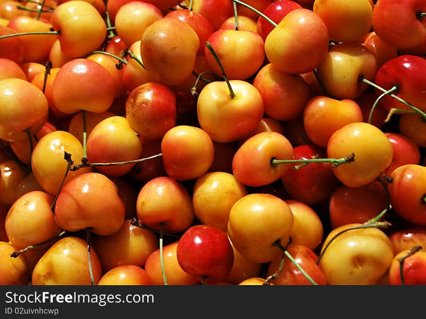 Red and yellow cherries texture