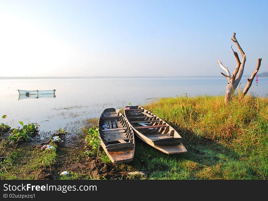 Twin boat in the river of thailand in the morning.