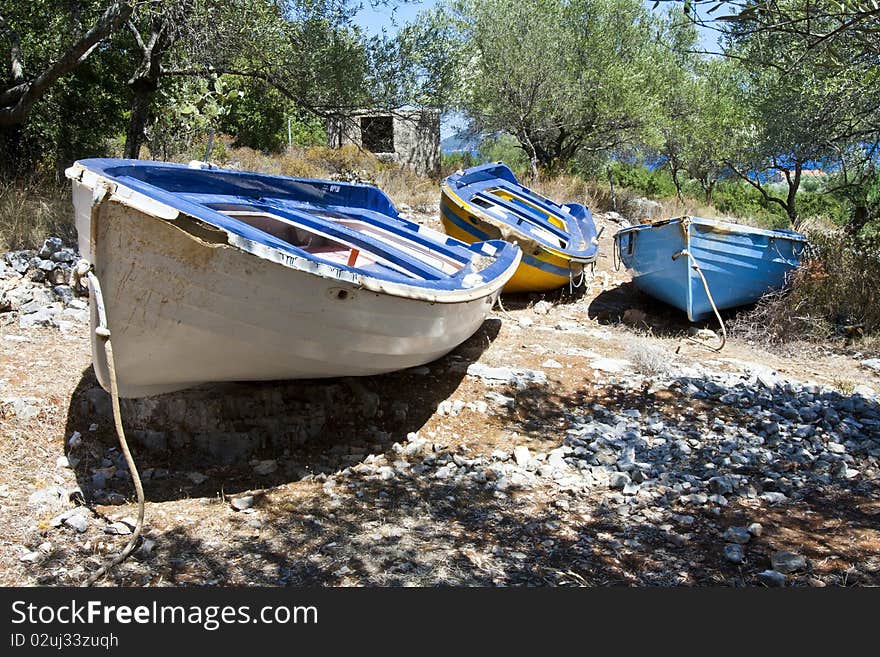 Old rowing boats putted up onto dry land