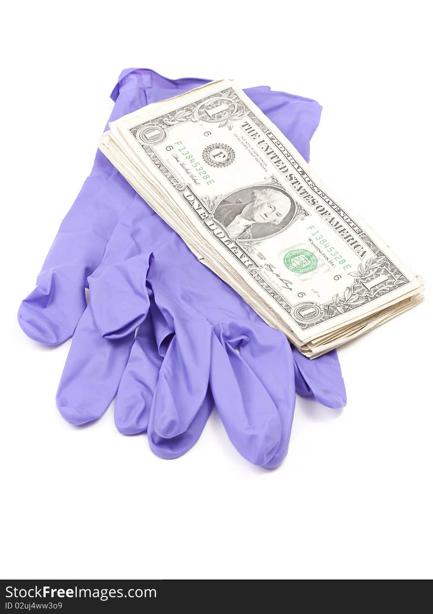 Dollar Bills on Forensic Gloves against white background Note: Differential Focus. Dollar Bills on Forensic Gloves against white background Note: Differential Focus