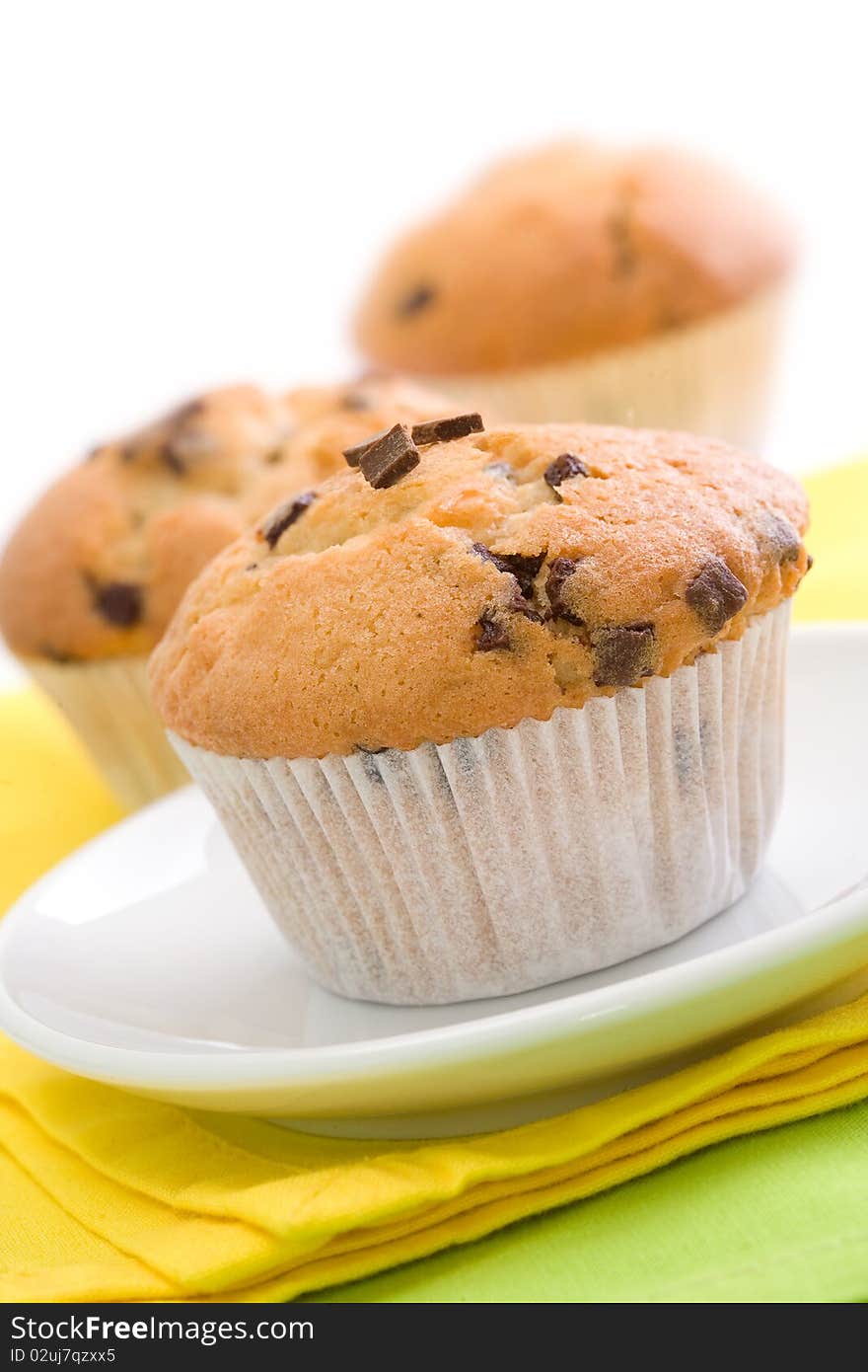 Chocolate chip muffins on white background