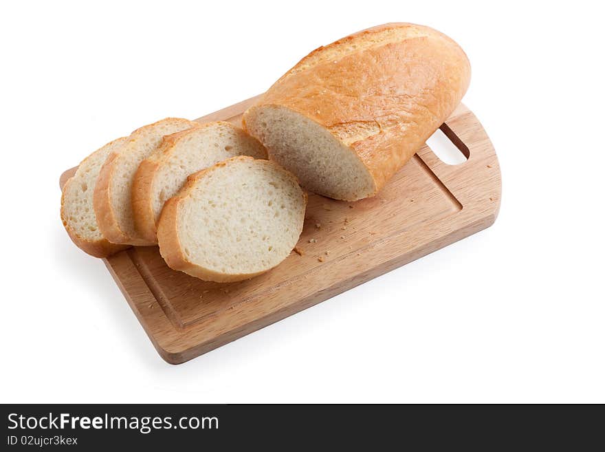 A long loaf sliced on a cutting board