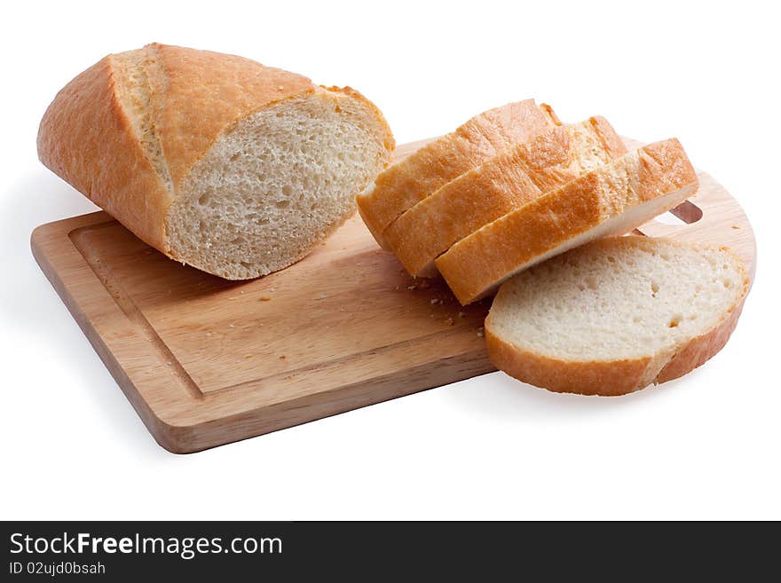 A long loaf sliced on a cutting board