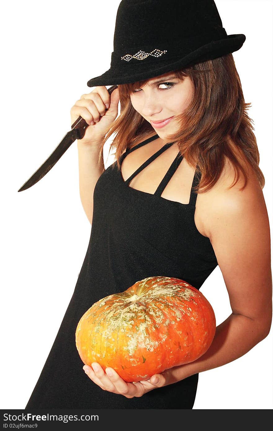 Witch holds in the hands pumpkin and knife