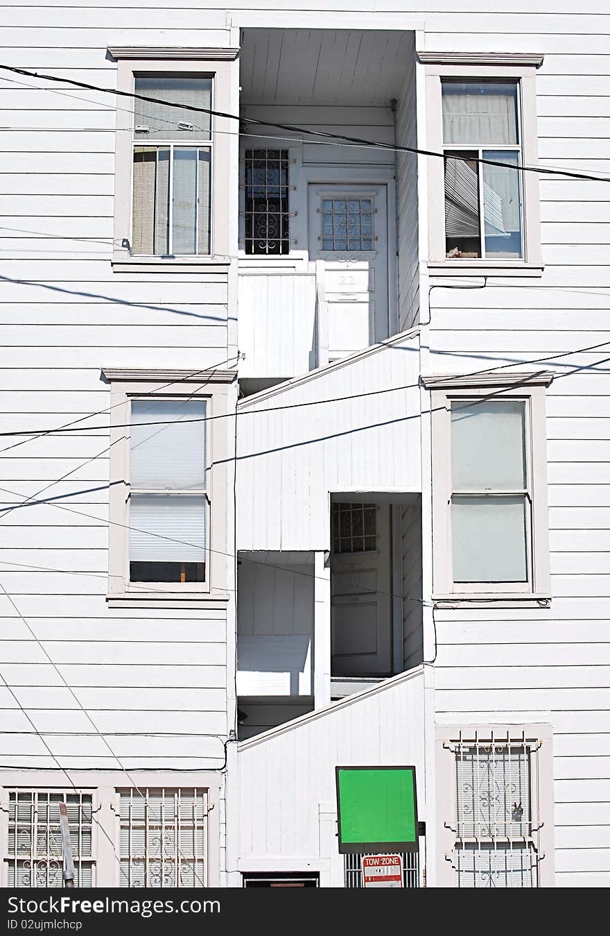 White wooden windows on a white house