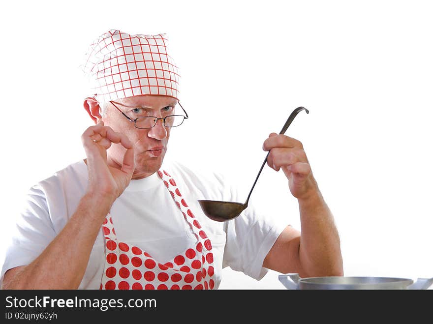 A man with ladle doing okay hand signal. A man with ladle doing okay hand signal