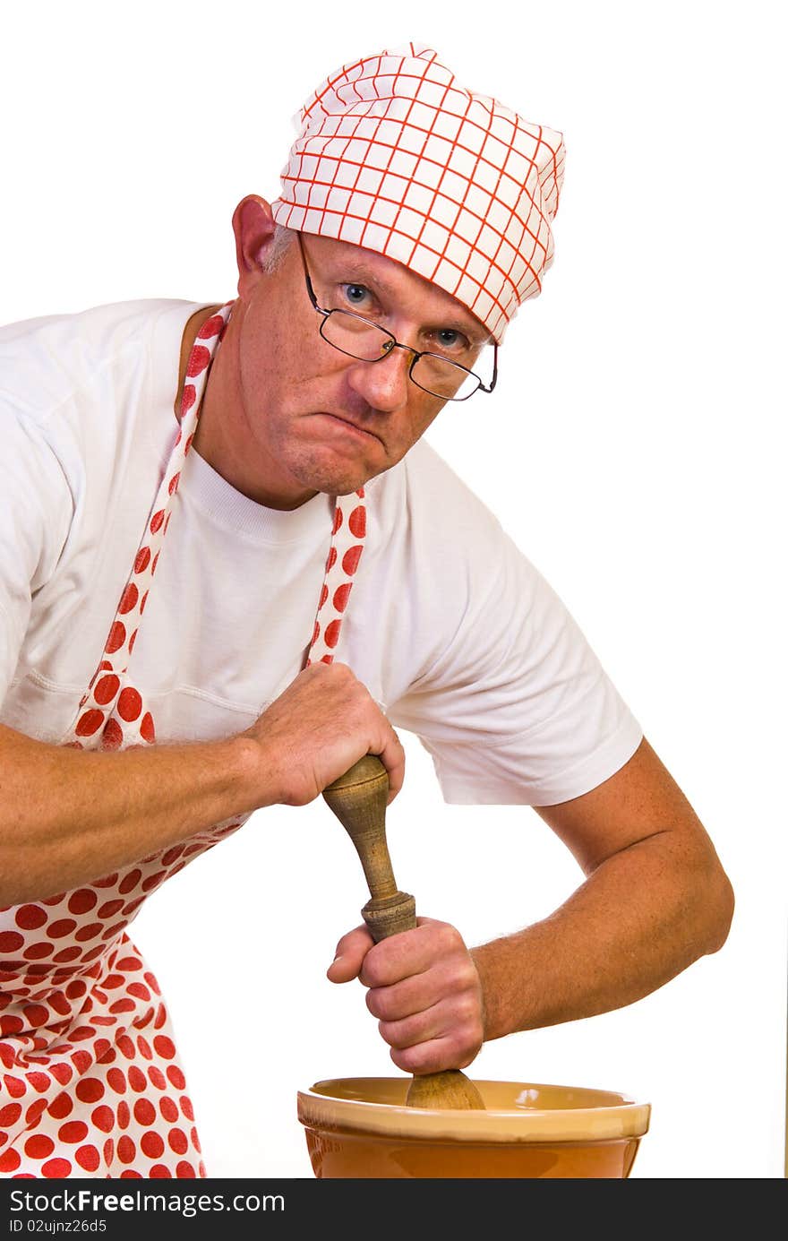 A man stiring in bowl with wooden pin. A man stiring in bowl with wooden pin