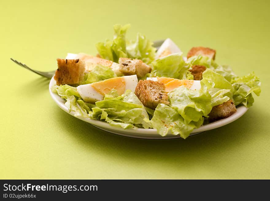 Salad with edds on green background. Salad with edds on green background