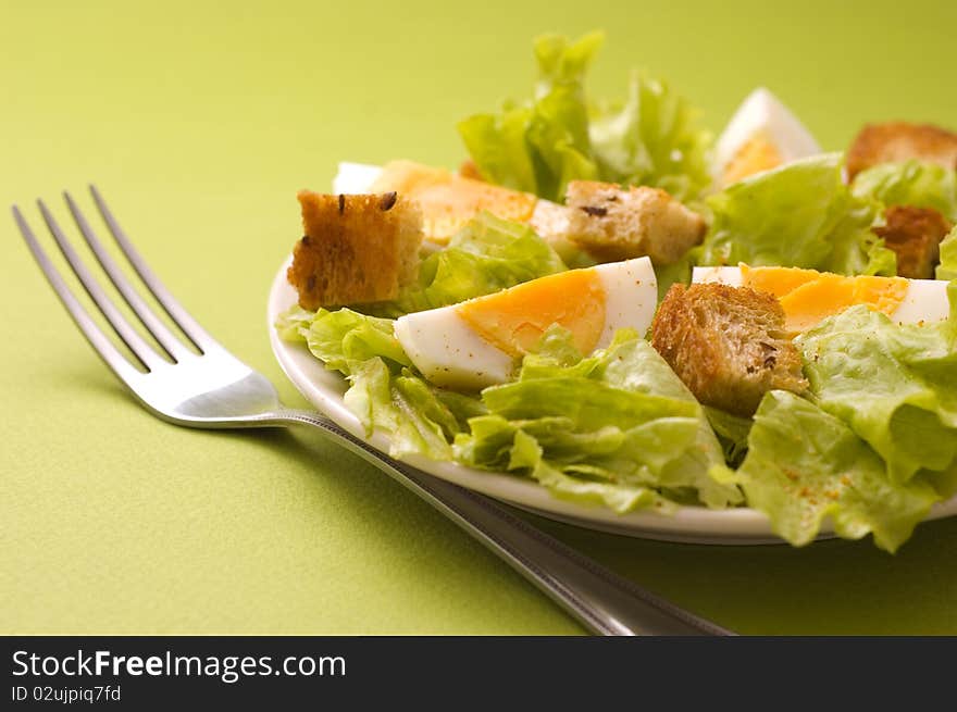 Salad with edds on green background. Salad with edds on green background