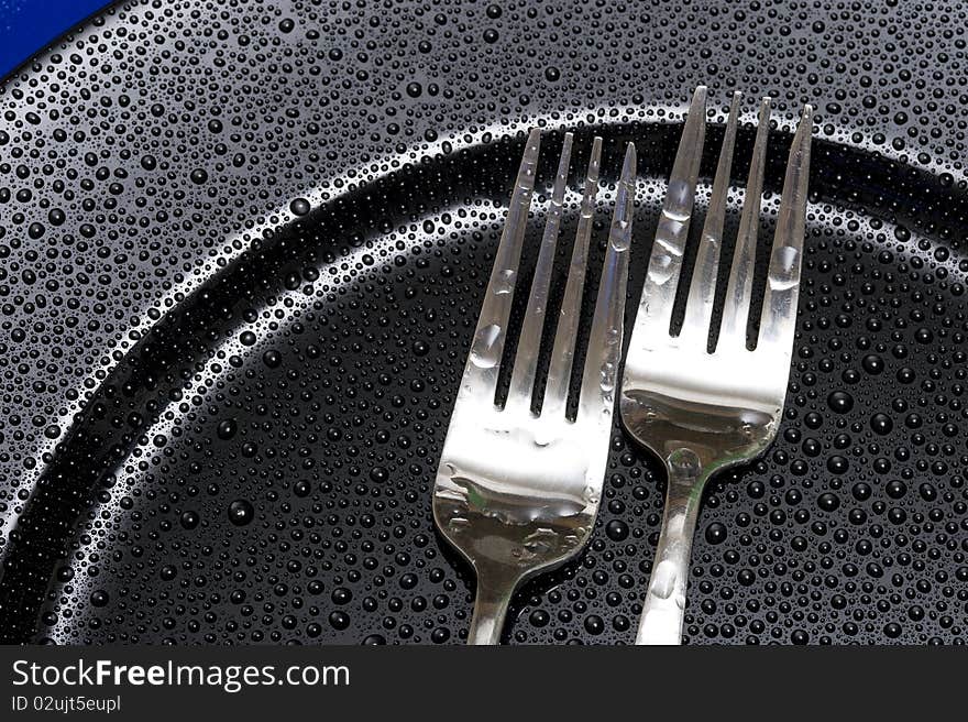 Fork on the black background