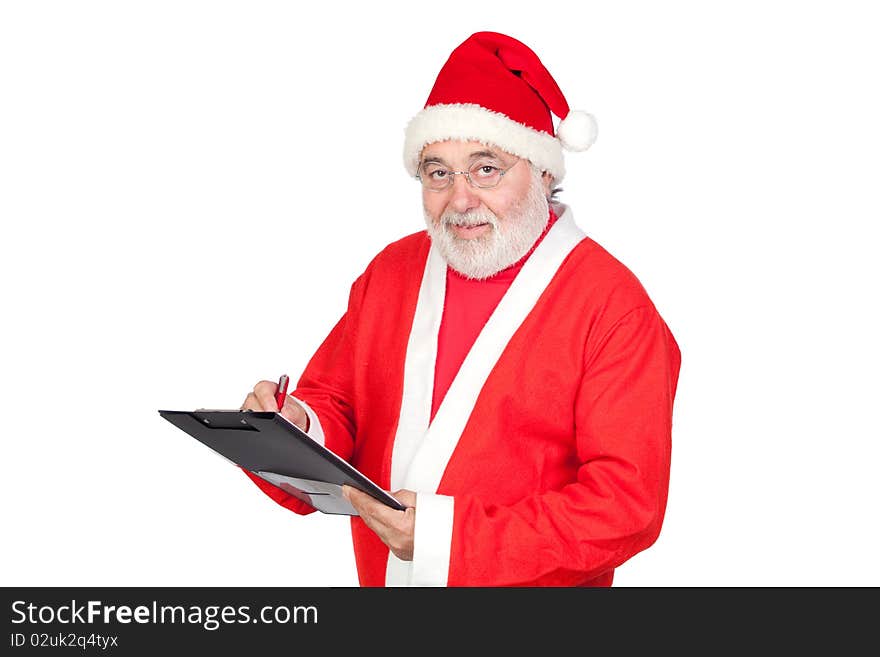 Smiley Santa Claus writing on clipboard isolated on white background