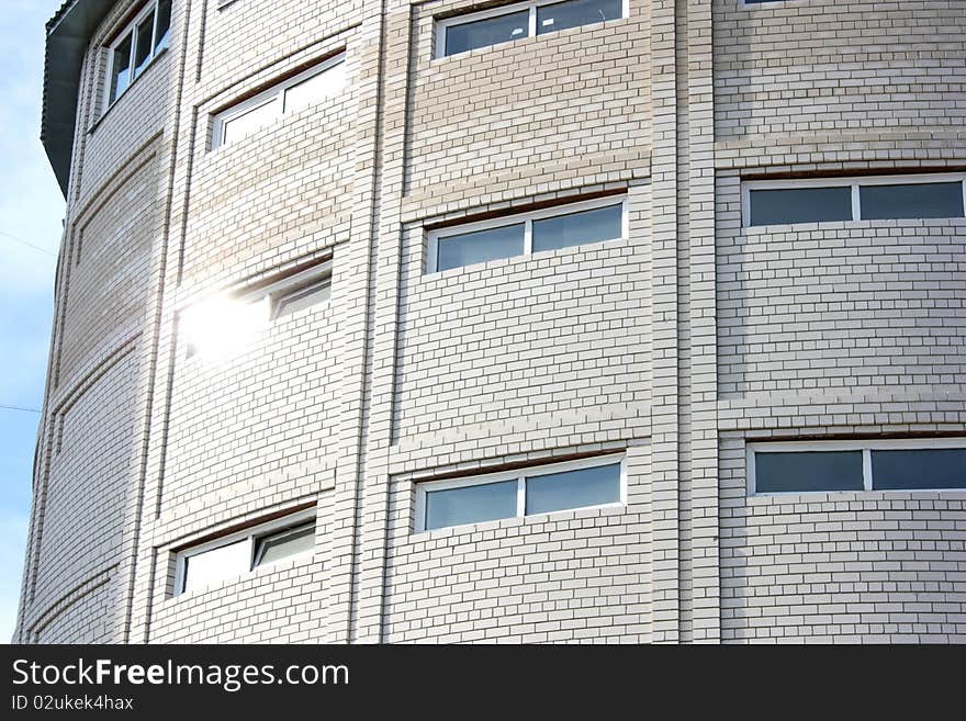 Many-storeyed garage from a white brick for cars