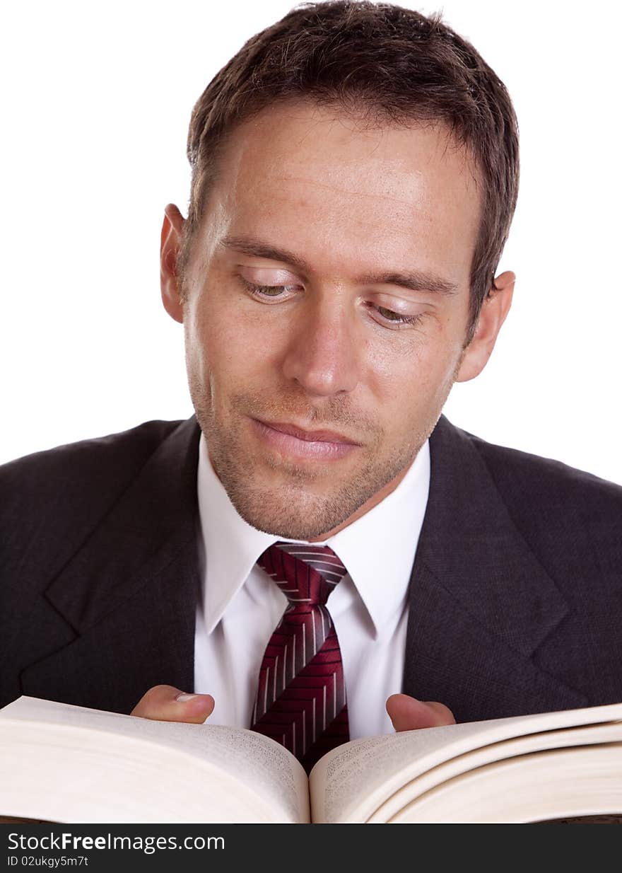 A man reading in a book.